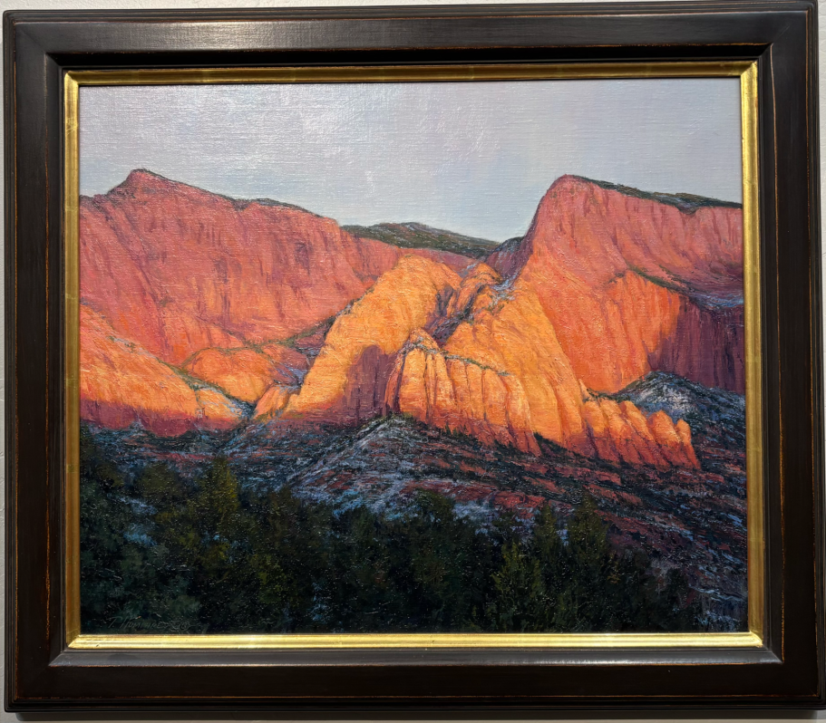 Kolob Evening Sunlit red rock formations with shadows, framed in a decorative border.