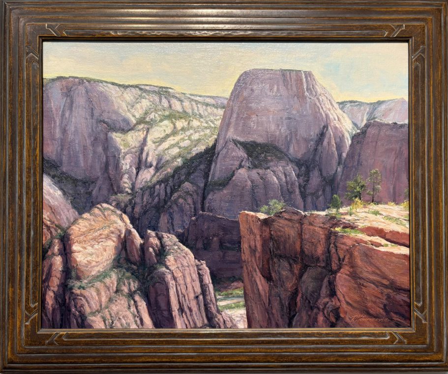 West Rim - Zion A scenic view of rugged cliffs and valleys under a clear sky.