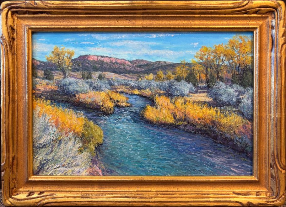 Sevier Gold A serene landscape featuring a winding river surrounded by colorful autumn foliage.