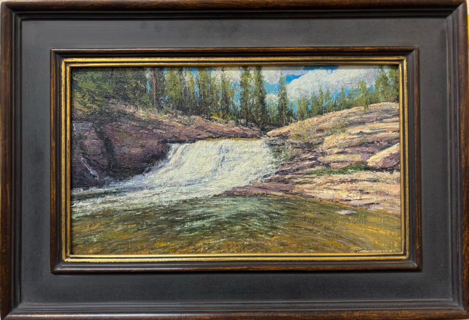 White Water - Upper Provo River A serene waterfall cascading over rocks, surrounded by trees and blue sky.