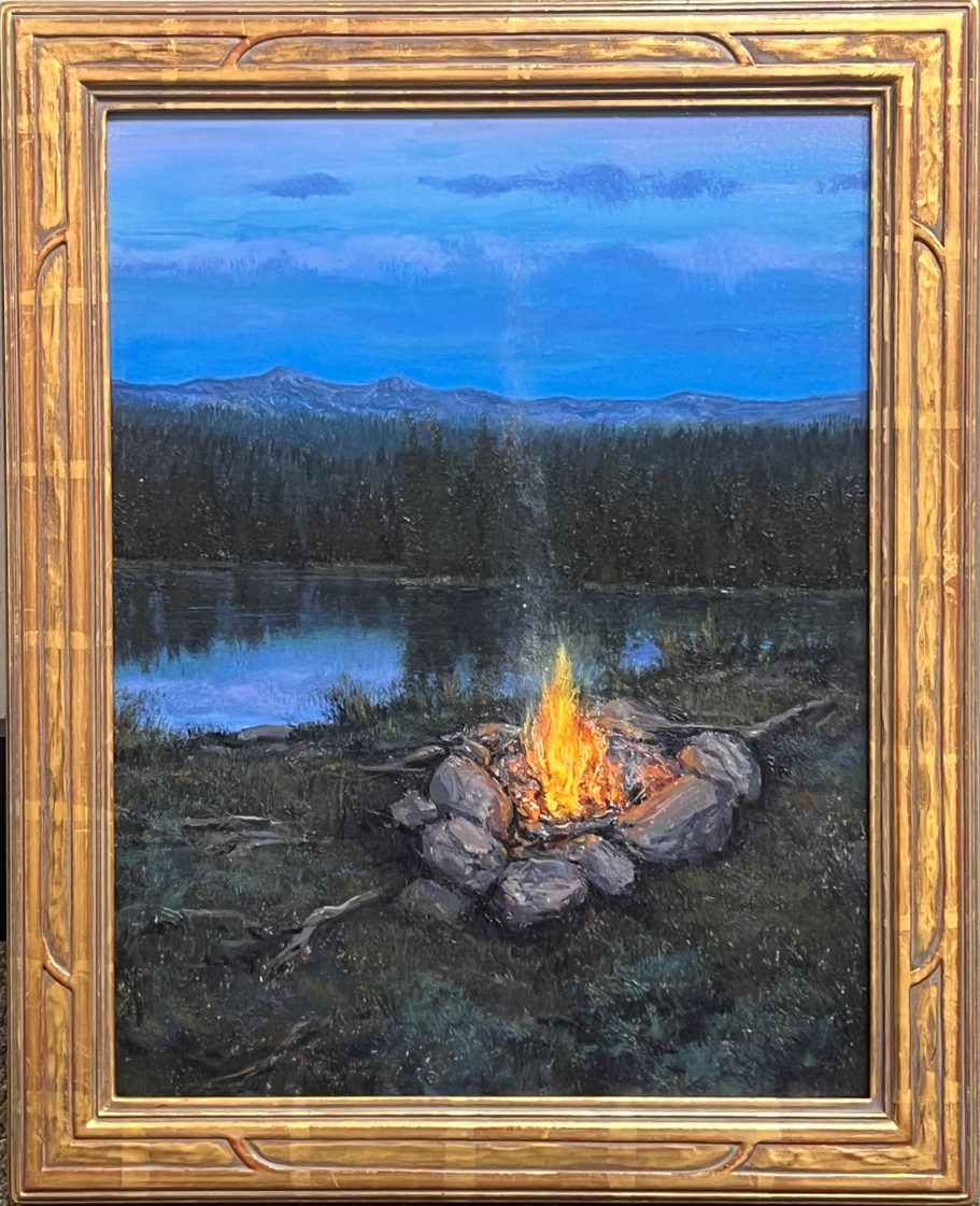 Campfire Memories A serene campfire surrounded by stones near a tranquil lake with mountains in the background.